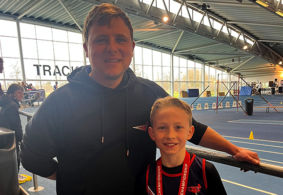 Daryl Blows, chairman of SSAthletics, with a child who competed in a filed event